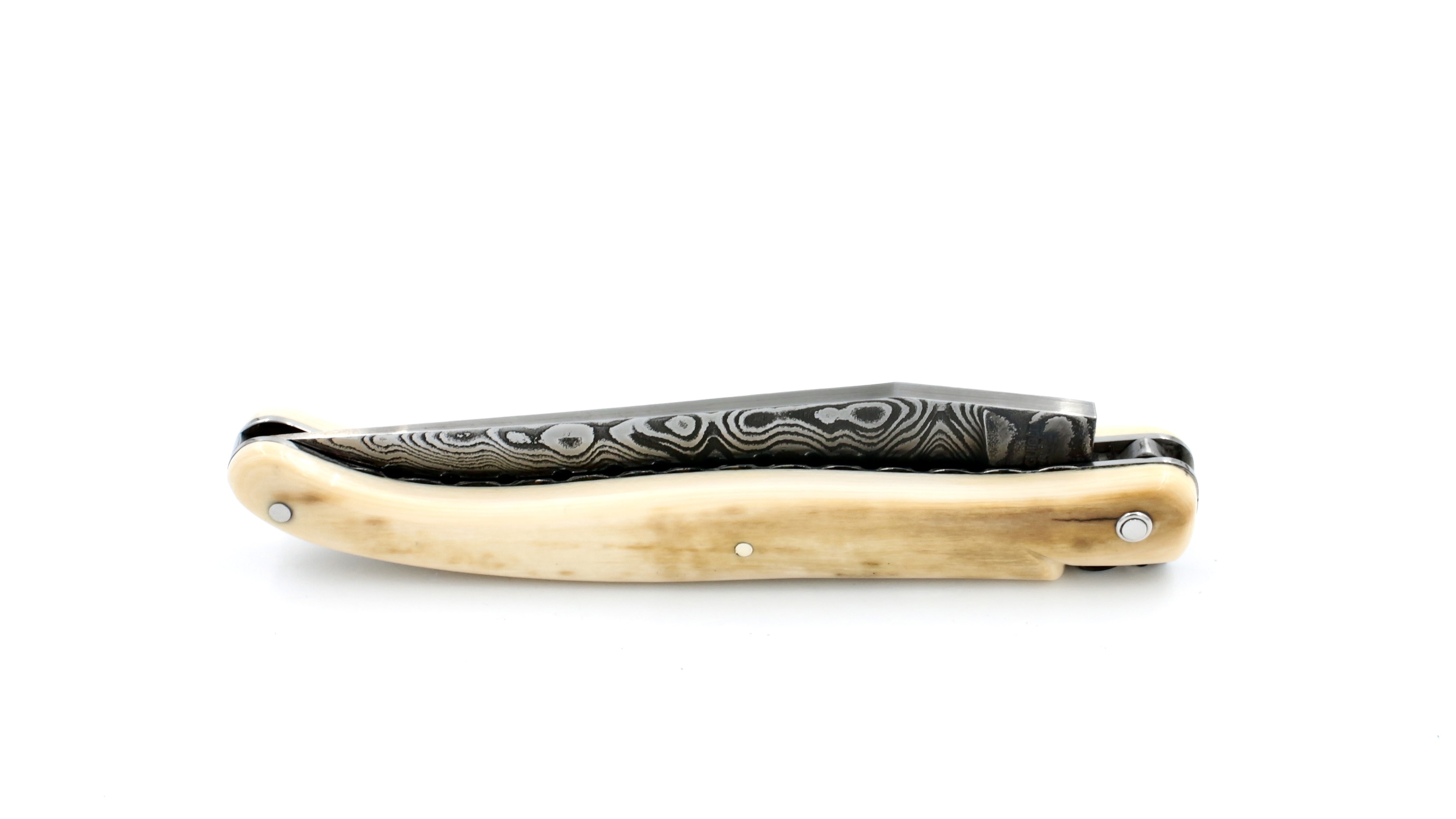 Laguiole en Aubrac Mammoth ivory crust full handle with chiseled plates damascus blade 12 cm