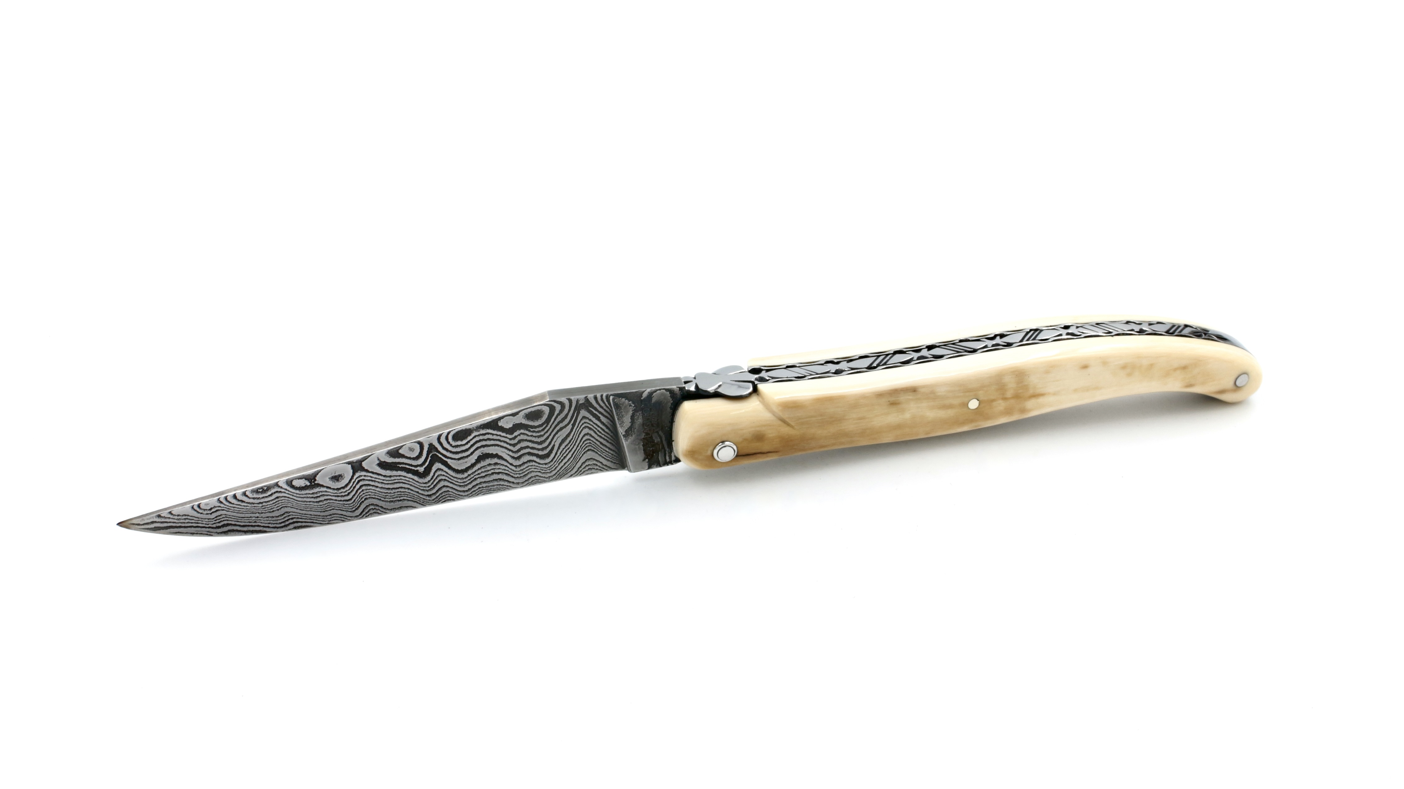 Laguiole en Aubrac Mammoth ivory crust full handle with chiseled plates damascus blade 12 cm