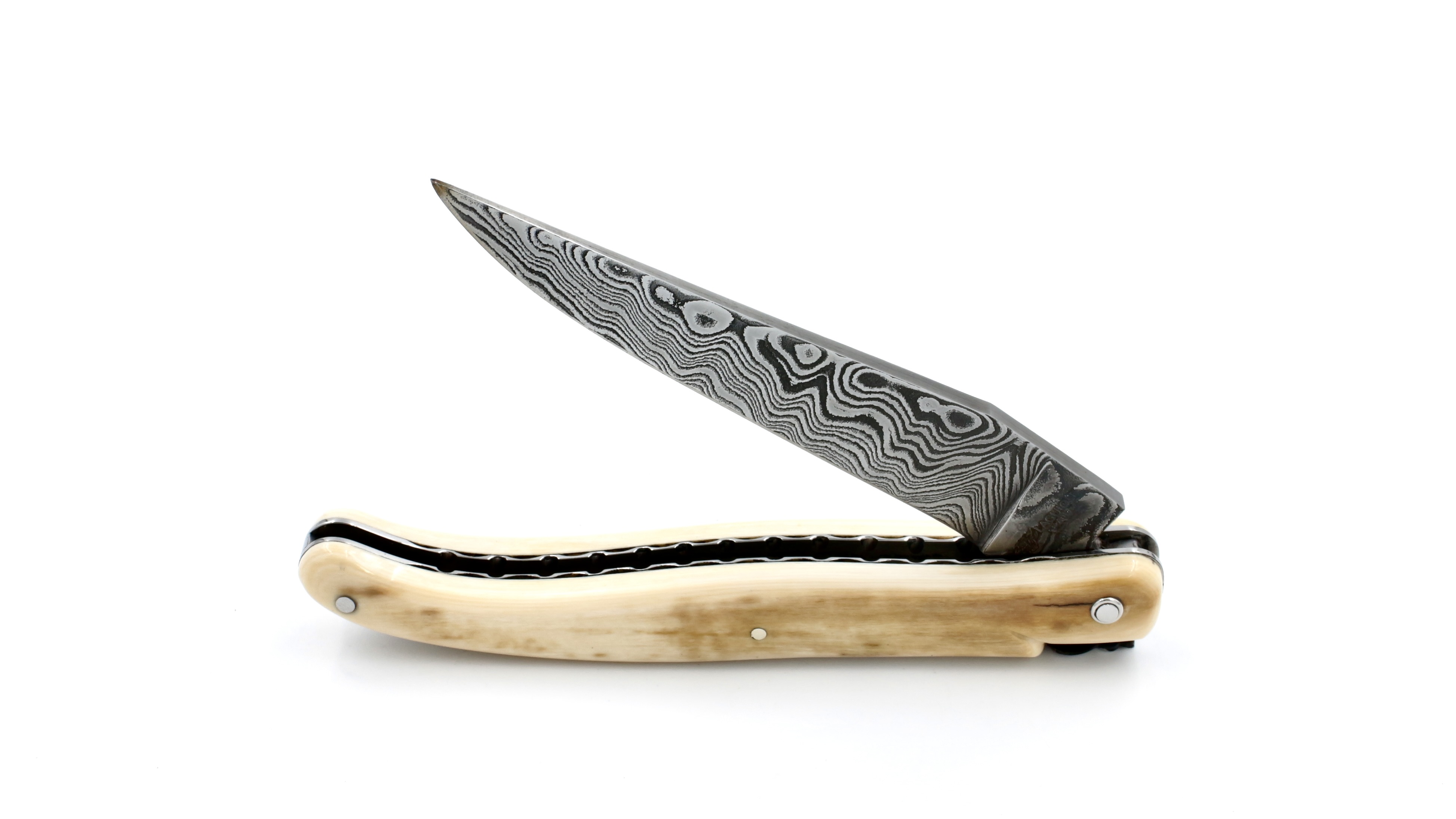 Laguiole en Aubrac Mammoth ivory crust full handle with chiseled plates damascus blade 12 cm