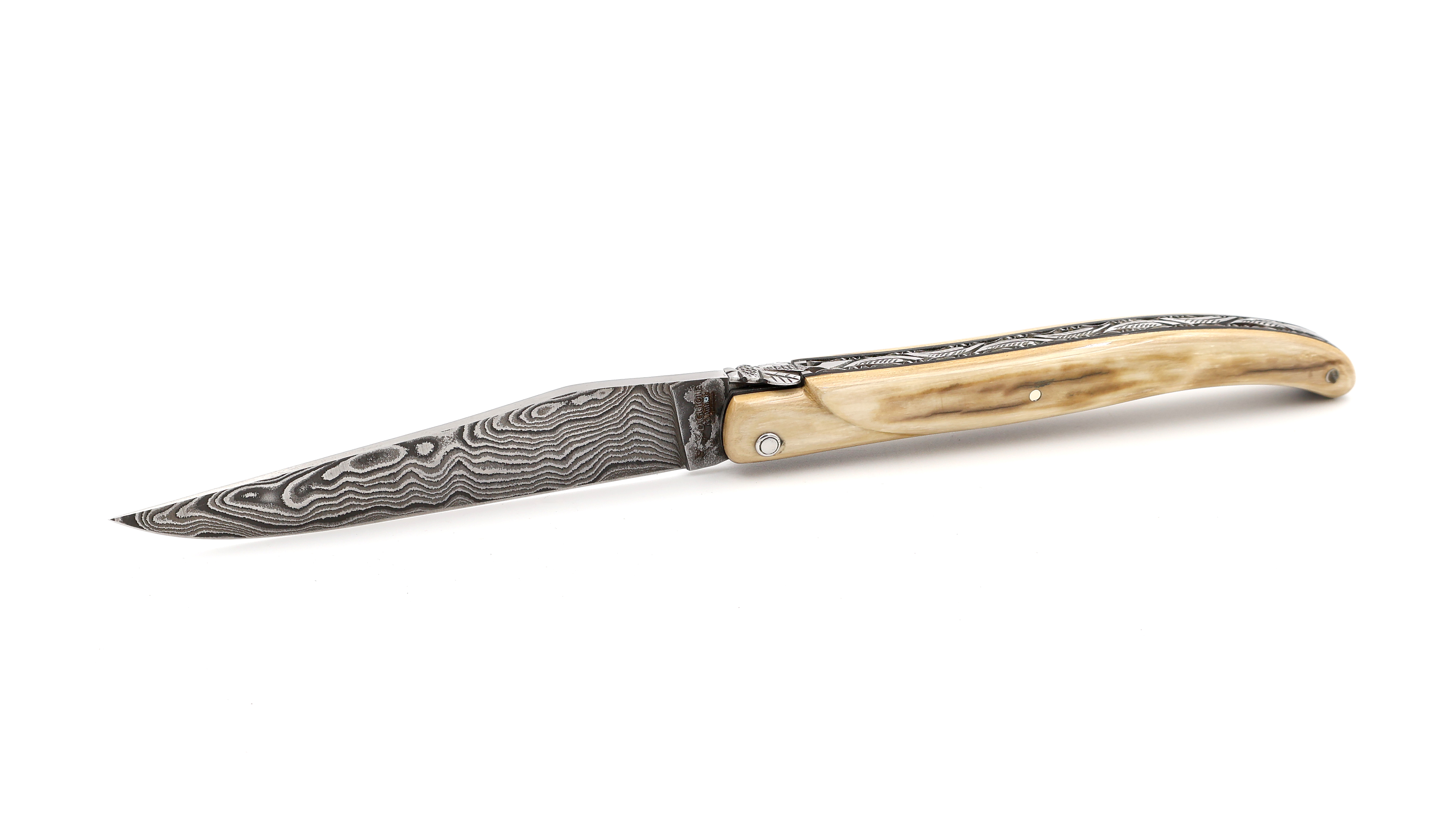 Laguiole en Aubrac Mammoth ivory crust full handle with chiseled plates damascus blade 12 cm