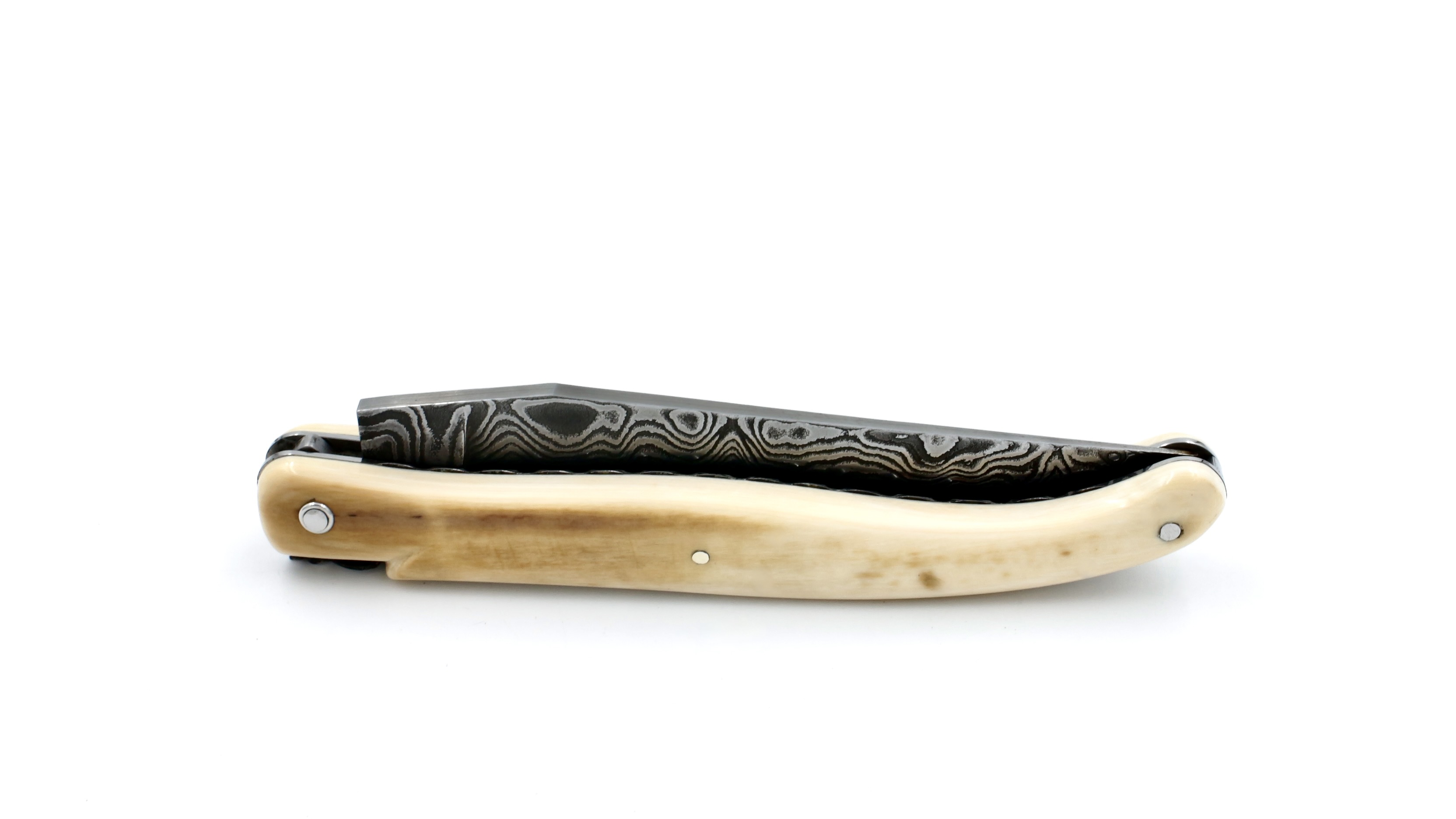 Laguiole en Aubrac Mammoth ivory crust full handle with chiseled plates damascus blade 12 cm