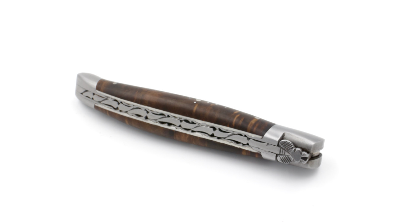 Laguiole en Aubrac laguiole knife chiseled plates laurel wood12 cm