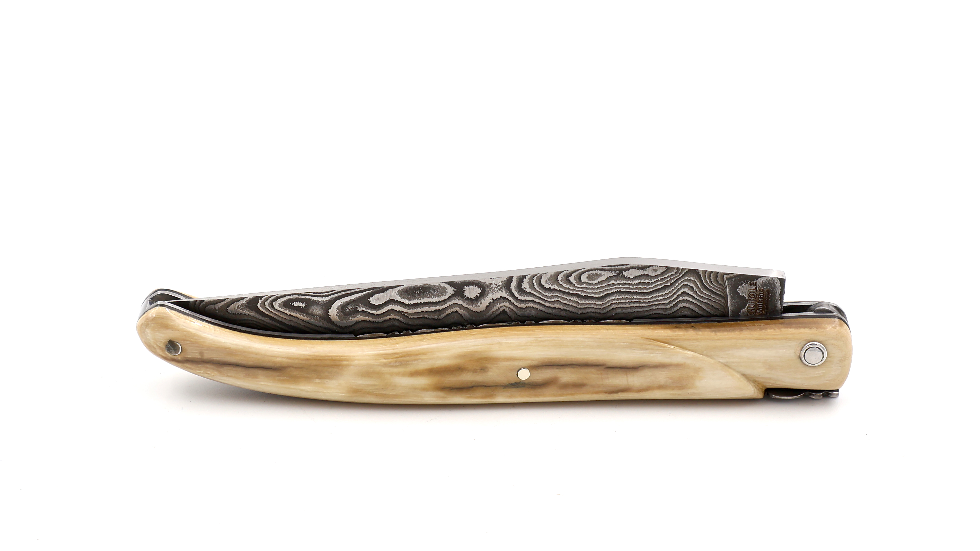 Laguiole en Aubrac Mammoth ivory crust full handle with chiseled plates damascus blade 12 cm