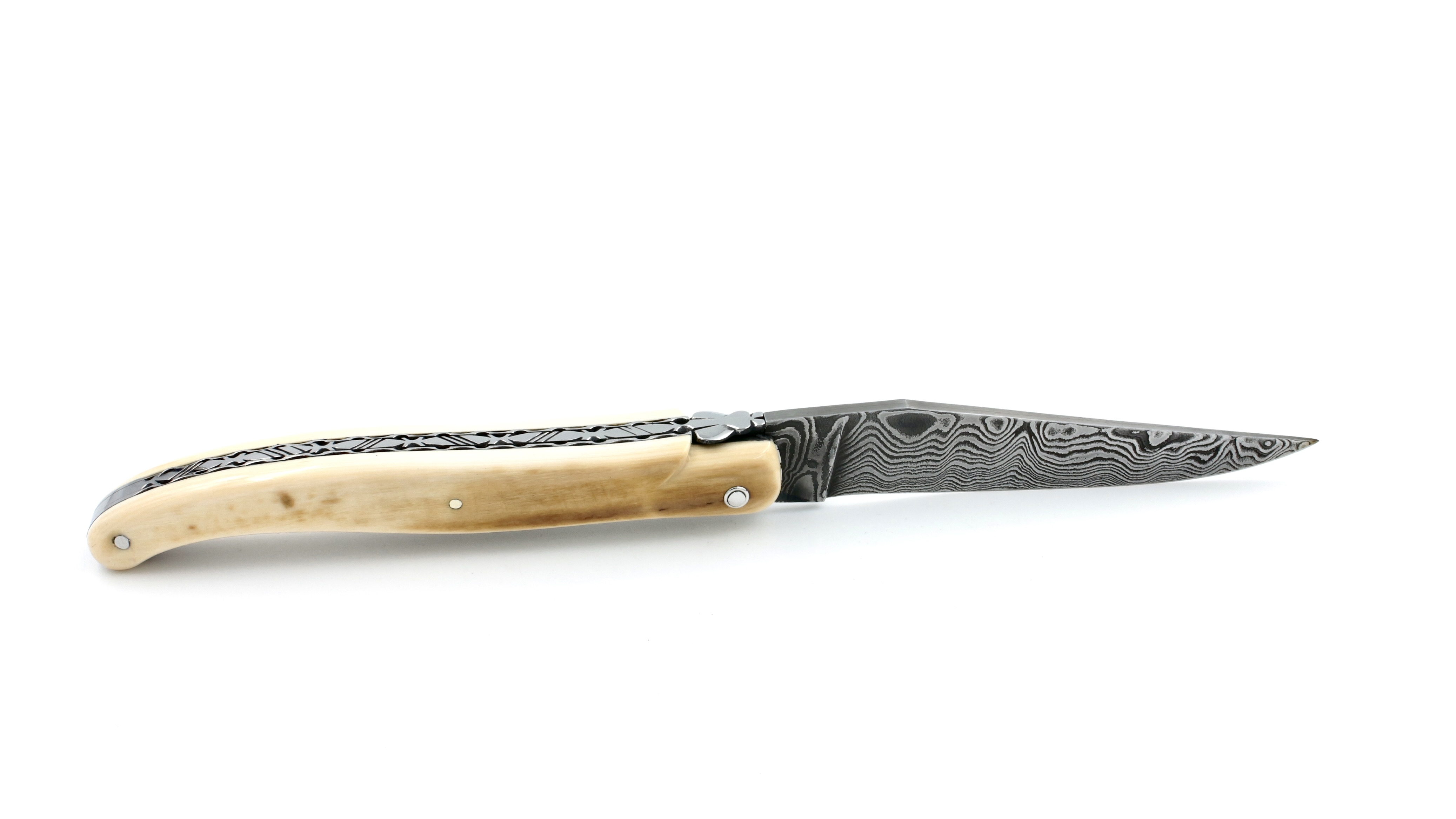 Laguiole en Aubrac Mammoth ivory crust full handle with chiseled plates damascus blade 12 cm