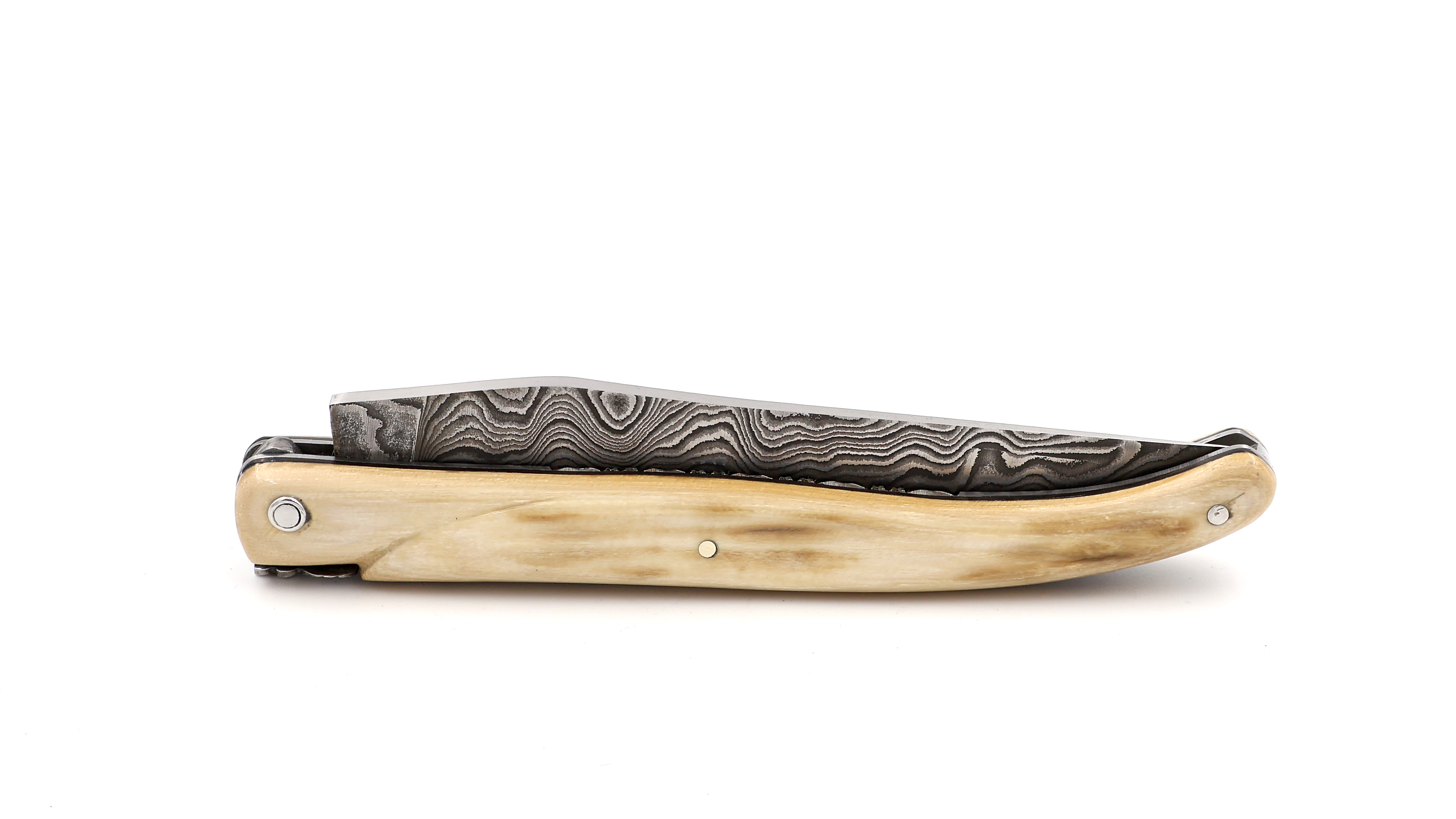 Laguiole en Aubrac Mammoth ivory crust full handle with chiseled plates damascus blade 12 cm